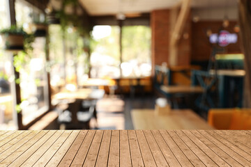Empty wooden surface in cafe. Space for design