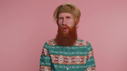 Displeased upset hippie redhead bearded man reacting to unpleasant awful idea, dissatisfied with bad quality, wave hand, shake head No, dismiss idea, dont like proposal. Hipster guy on pink background