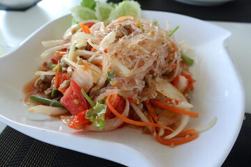 Thai spicy noodles salad or Vermicelli salad (Yum woon sen)  healthy food. © Kanomaoi