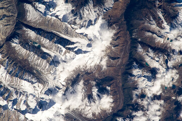 Aerial view of Bhutan shows the Himalayan peaks, lakes, and glaciers from above. Digitally...