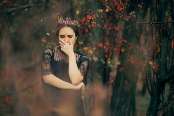 Unhappy Queen Crying in the Magical Forest. Dark princess feeling desperate and sad suffering a loss  © nicoletaionescu