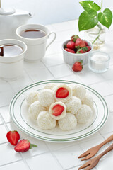 Lo mai chi, known in Mandarin as nuomici, is a glutinous sticky rice ball. Famous as a Chinese dessert, it taste sweet, soft and tough. With strawberry inside, dusted with dried coconut on the outside