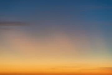 The dramatic colors of the sunset in the sky gradient from blue to orange.