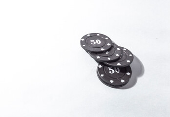 Poker coins, casino chips with white background and copy space.