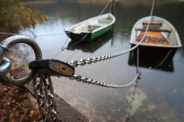 Rowing boats are secured with a chain and a padlock