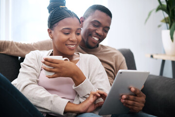 Digital tablet, relax and black couple on a sofa scrolling on social media, mobile app or the internet. Happy, smile and African man and woman reading messages together on a device in the living room