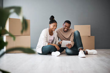 Real estate, property and black couple with boxes and tablet for furniture shopping or search renovating ideas. Happy owners, relocation and tenants on digital touchscreen on moving day in new home.