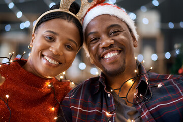 Christmas, love and portrait of a happy black couple at a festive party celebration with lights....