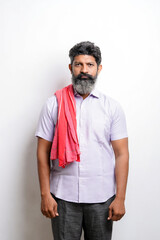 Fototapeta premium Indian farmer giving expression on white background.