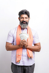 Indian farmer showing money on white background.