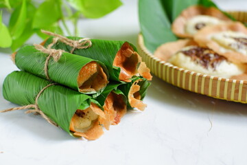 traditional pancake named serabi wrapped in banana leaves