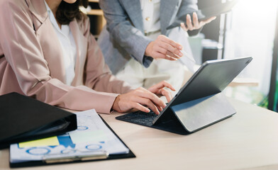 Team work process. Photo young business crew working with new startup project. Project managers meeting. Analyze plans, papers. At office.