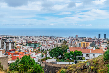 Fototapeta na wymiar Aerial view of the panorama of Santa Cruz de Tenerife and the Atlantic Ocean on the horizon, Spain. Cityscape in the Canary Islands
