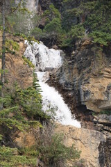 Fototapeta na wymiar waterfall in the mountains, Jasper National Park, Alberta
