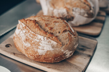 Freshly baked sourdough loaves on a benchtop