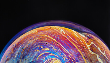 Virtual reality space with abstract multicolor psychedelic planet. Closeup Soap bubble like an...