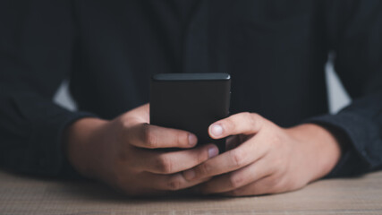 man hand holding and using smartphone, tablet, cell phone touching on screen. mobile phone application technology. copy space for text.