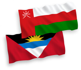 National vector fabric wave flags of Sultanate of Oman and Antigua and Barbuda isolated on white background. 1 to 2 proportion.