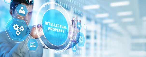 Business, technology, internet and network concept. Virtual screen of the future and sees the inscription: Intellectual property.