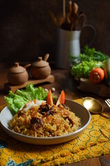 a plate of fried rice with meat 