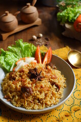 a plate of fried rice with meat 