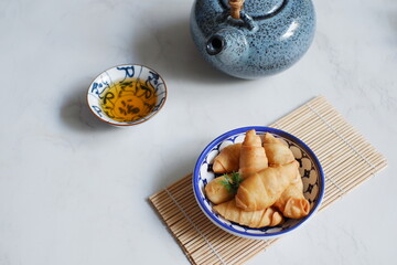 a plate of fried banana pastry 