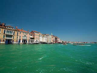 Fototapeta na wymiar Boat Ride along the Venezia lagoon with clear turquoise water