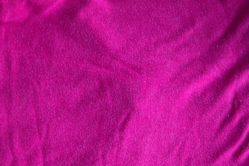 Fototapeta na wymiar pink canvas fabric cotton background with folds textile