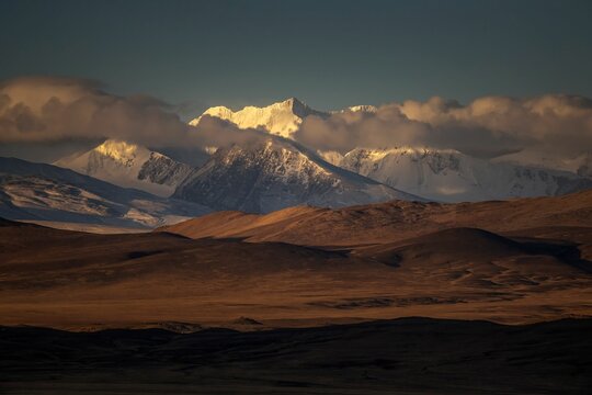 Scenic Kangchenjunga peak covered by floating clouds in the sky in Kamba County, Xigaze, China