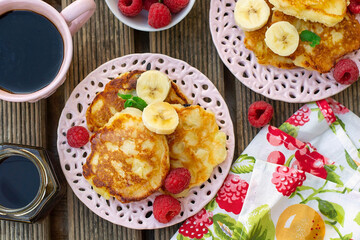 Sweet fruit pancakes with apples, bananas and raspberries