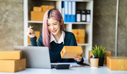 Fototapeta premium Young asian Woman Thinking and Working on sell online in cozy house, Modern Lifestyle of New Generation People.