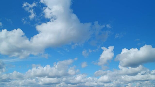 Cirrus and cumulus on different layers cloudscape moved. Clearing day and good windy weather. Timelapse.