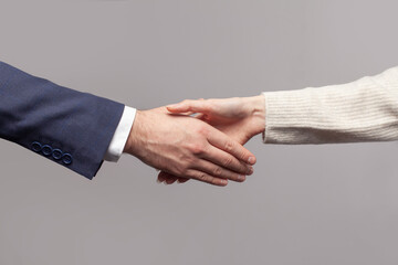 Business shake hands. Isolated on grey background