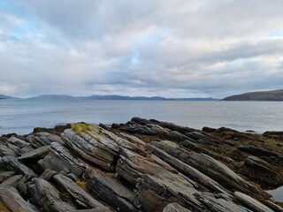 Fototapeta na wymiar sharp stone formation on the sea shore in northern Norway