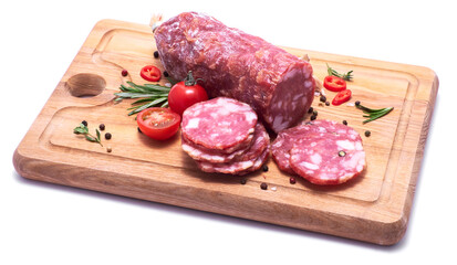 Sliced Smoked dry Salami sausage on wooden cutting board isolated on white background
