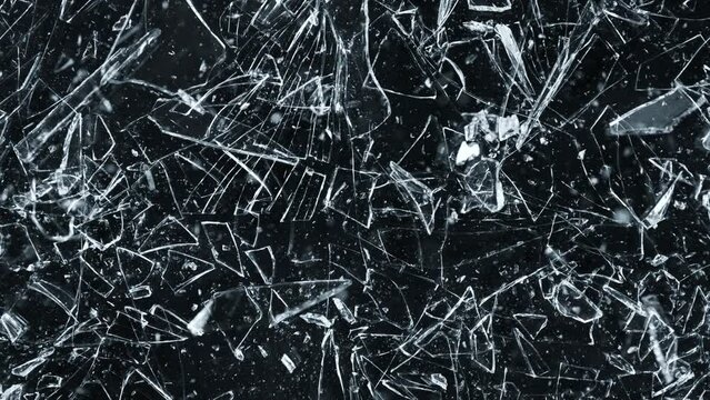 Super Slow Motion Shot of Shattering Glass Shards Flying Towards Camera on Black at 1000fps.