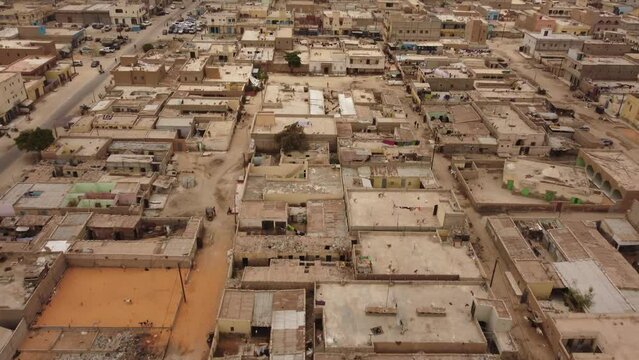 Drone shot of Nouakchott city, Mauritania. The camera moves forward showing the ugly square buildings.