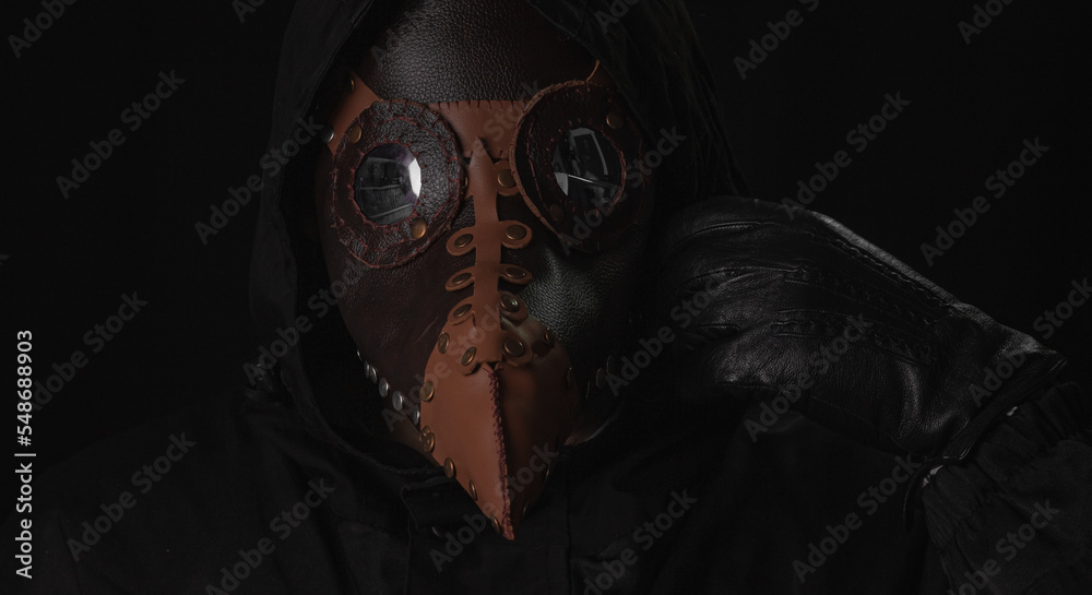 Wall mural Dark horror figure in black hood in plague doctor mask - Wall murals