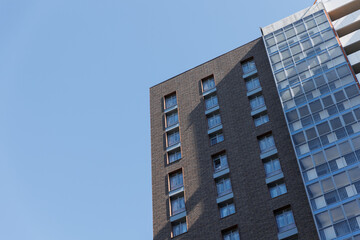 Fototapeta na wymiar A new high-rise building against the blue sky. 