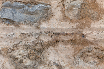 The surface of the sandy rock. Durable building material and archaeological site. Background. Space for text.