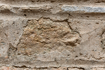 Surface of beige sandy rock. Durable building material and archaeological site. Background. Space for text.
