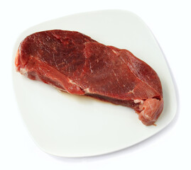 Raw red meat on a plate
