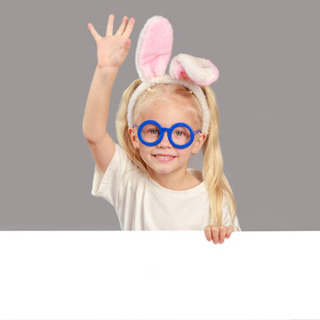 Cute happy girl with easter eggs and bunny ears holding a white lsit for inscriptions, empty space, easter composition, religious holidays concept, spring mood, isolated.