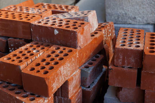 Red bricks on a construction site. 
Composition of red bricks (ceramic blocks). Ceramic blocks from a new development in the construction sector.