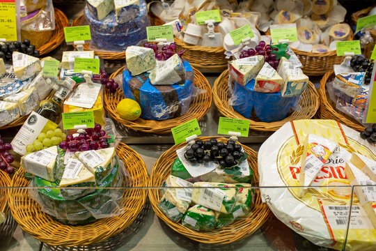 A Large Selection Of Cheeses With Different Types, Textures And Flavors On Shelf In A Grocery Store. Artistic Design Of Product Display Using Decor. Minsk, Belarus, 2022