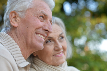 Nice elderly couple in a autumn park