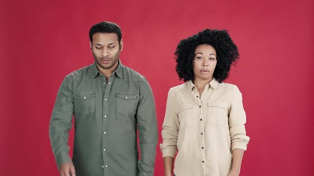 Indian man and African American woman do facepalm gesture