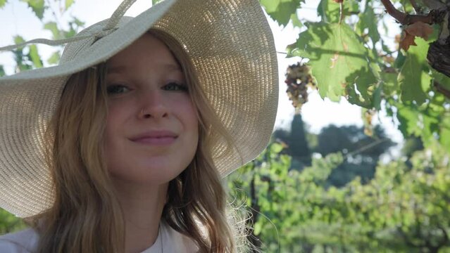 Closeup Of A Woman With Hat In A Vineyard