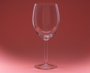 photo of an empty wine glass on a pink background
