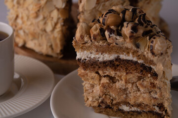 photo a cup of coffee with a piece of cake on a plate